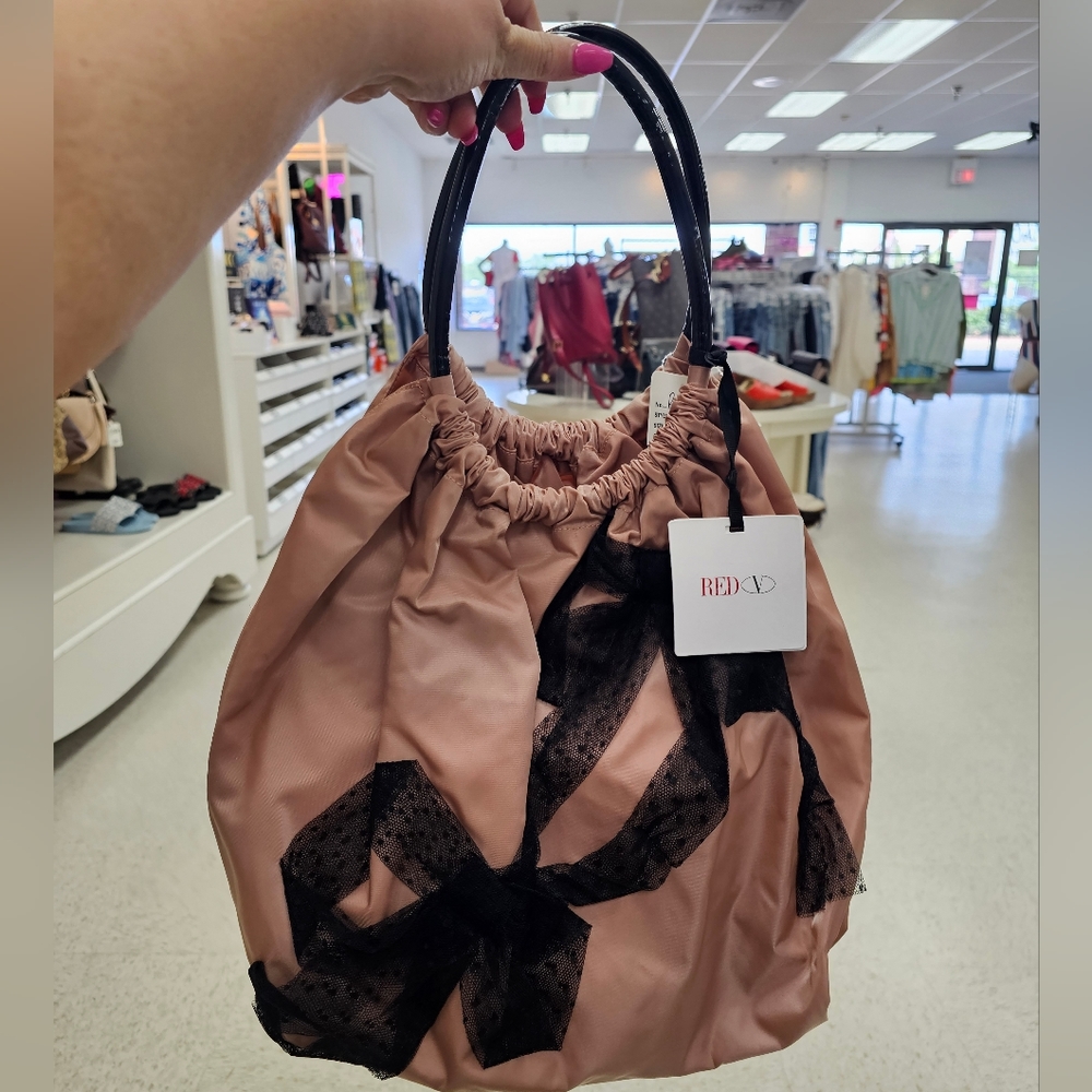 Red Valentino bag the color is light pink . New with tags